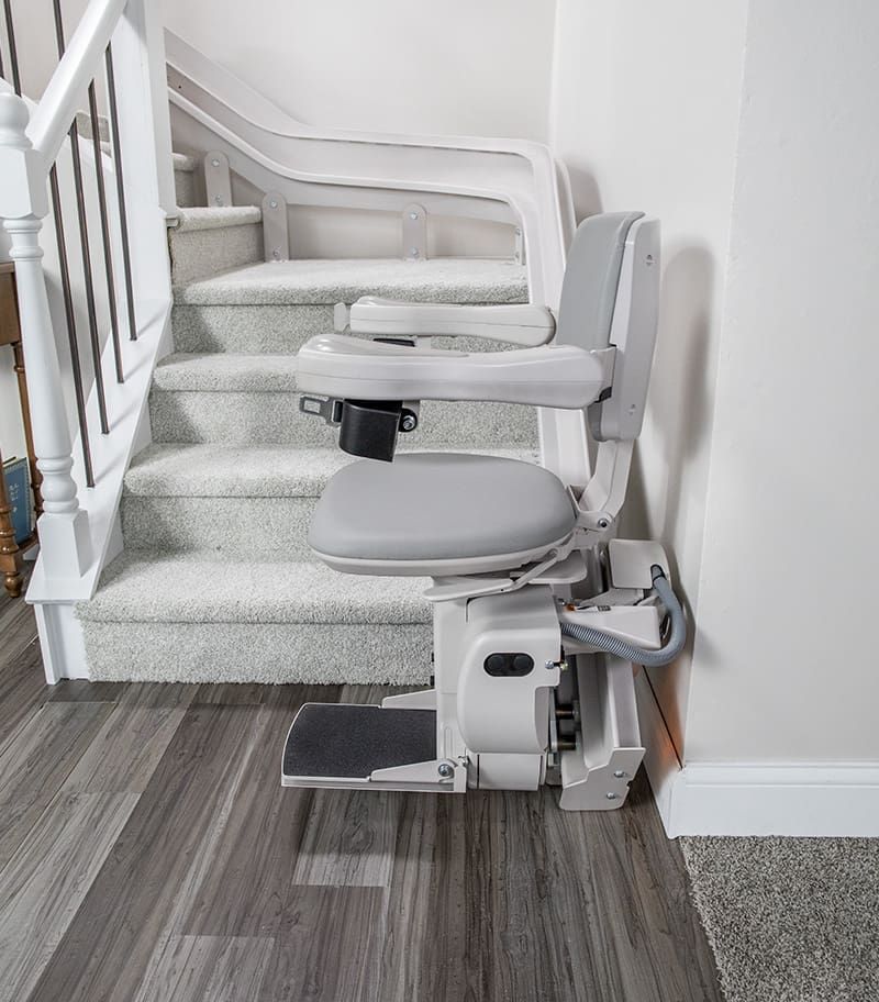Bruno Elite Heavy Duty Curved Stair Lift at Bottom of Rail In Folded Out Position