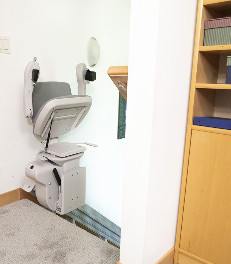 Bruno Elite Bariatric Straight Stairlift In Folded Position at Top of Stairs
