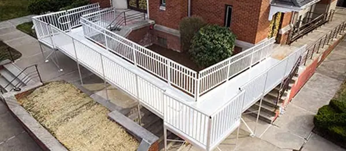 Modular Aluminum Commercial Ramp from National Ramps installed in front of red brick building