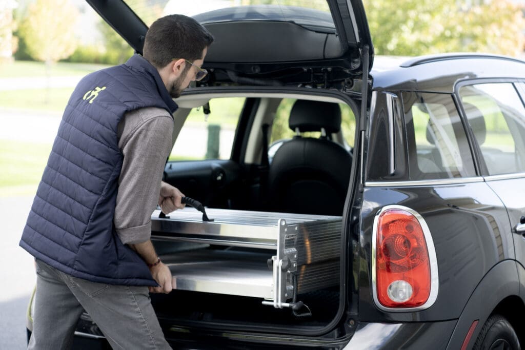 Aluminum Portable Wheelchair Ramp from National Ramps being easily stowed in car's trunk